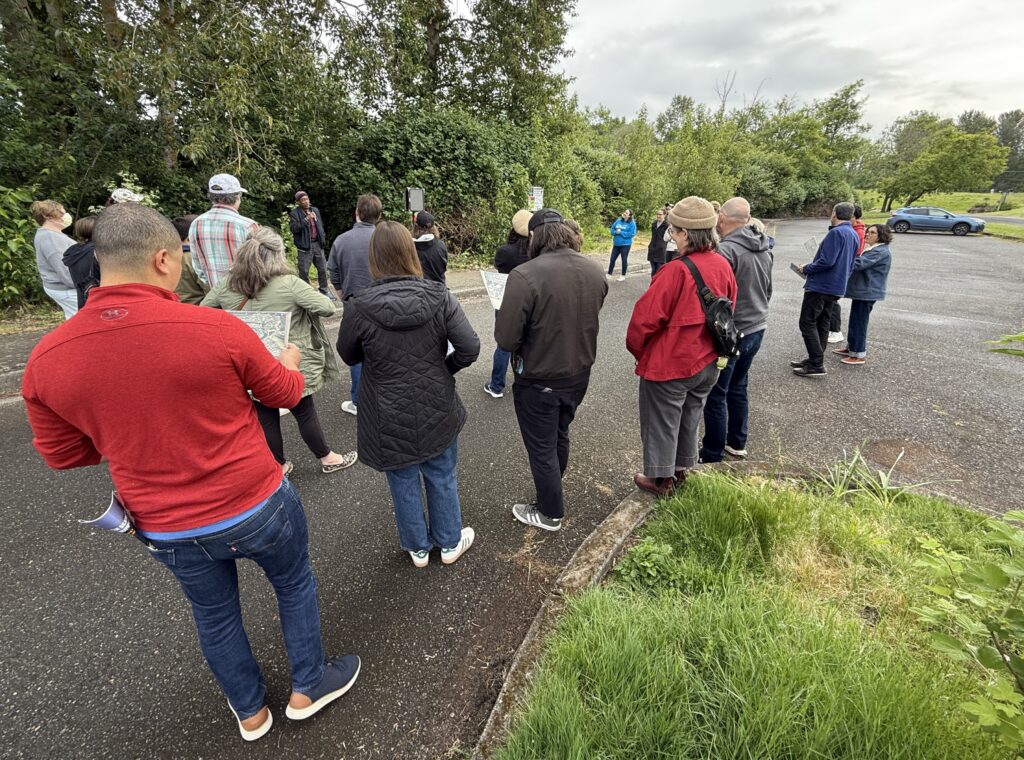 Several Habitat staff members listen to Ed Washington share his memories of growing up in Vanport